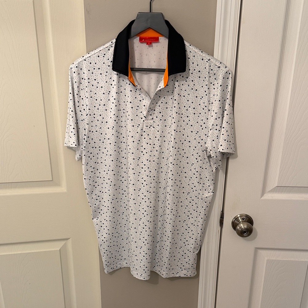 Elegant White Polo with Black Collar and Orange Trim